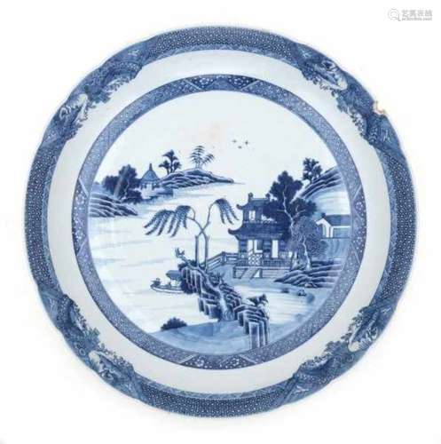 A large Chinese blue and white export charger, decorated with pagodas in a riverscape. 18th