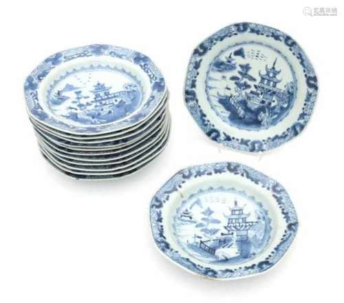 A set of thirteen hexagonal Chinese blue and white export plates, decorated with pagodas in a