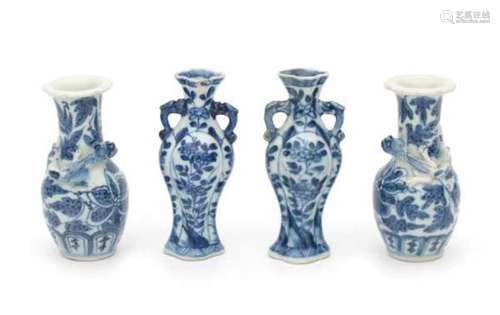 Two pairs of miniature Chinese blue and white vases, one pair with modelled chilong around the neck.