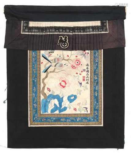 A Chinese silk embroidery, with two birds amidst prunus and peonies. 20th century58 x 48 cm.- - -