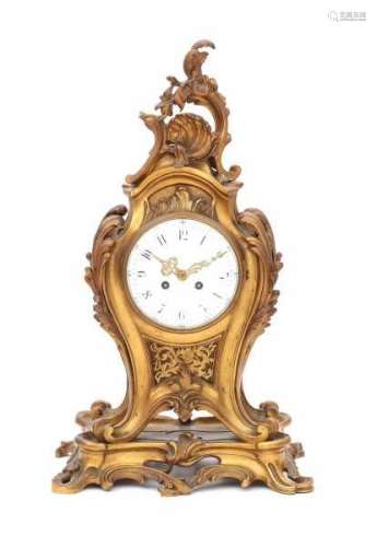 An ormulu mantle clock. Stamped medaille d'argent, Vincenti, 1855. Louis Quinze style, 19th
