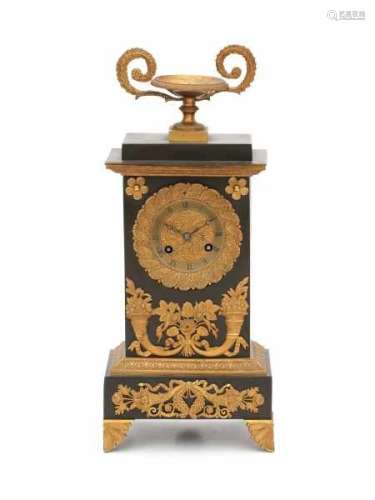 A French part-gilt mantle clock, with gilt cornucopia mounts. Circa 1800.height 35 cm.- - -29.00 %