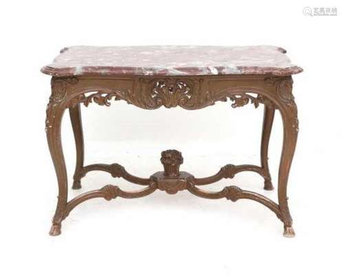 A Baroque style table with red marble top. 19th century.Top 112 x 73 cm.- - -29.00 % buyer's premium