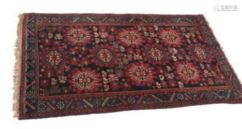 An oriental rug, Kazak. 19/20th century.Dimensions 210 x 128 cm.- - -29.00 % buyer's premium on