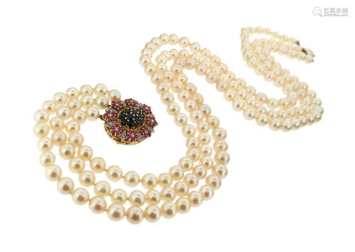 A three-row cultured pearl necklace