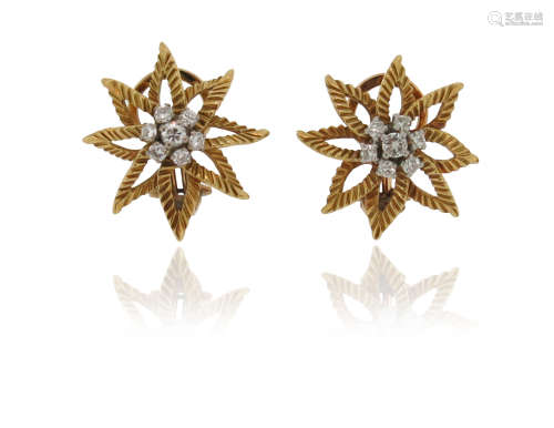 A pair of diamond flowerhead earrings