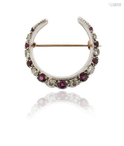 A ruby and diamond closed crescent brooch