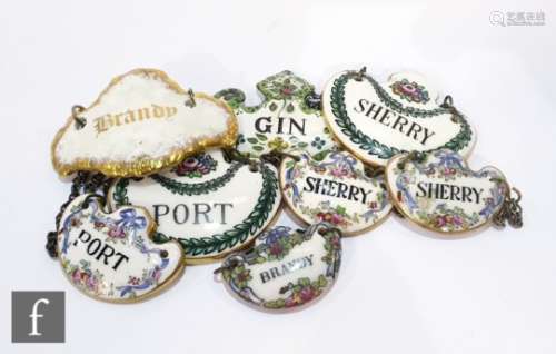Seven assorted 19th Century and later decanter labels with an enamelled example to include three