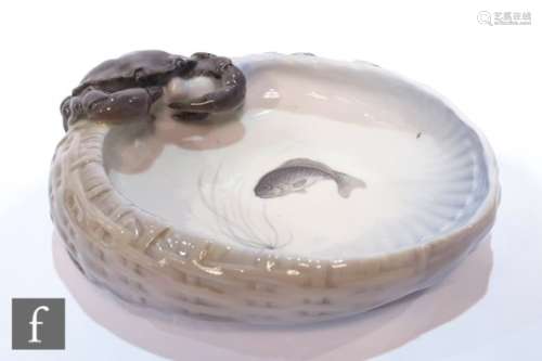 A Royal Copenhagen bowl modelled as a basket and mounted with a crab, painted fish interior, No