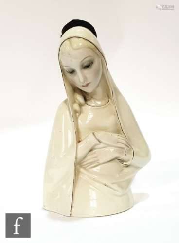 A 1930s Lenci porcelain figure of Madonna, wearing white veil and head turned and eyes downcast,