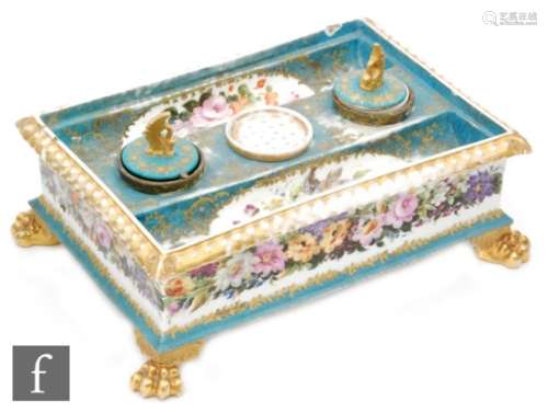 A 19th Century French porcelain Sevres style desk stand of rectangular form, raised on four gilt paw