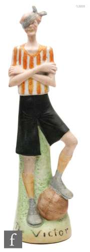 A 1920s German Schafer Vater bisque figure 'The Victor', modelled as a footballer wearing red and