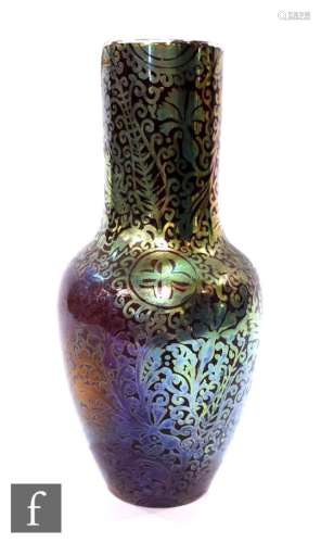 An iridescent earthenware Delphin Massiér vase, circa 1900, of tapered ovoid form rising to a