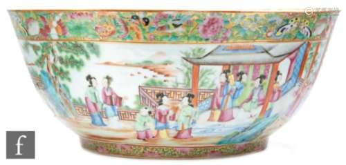 A 19th Century Chinese Canton famille rose punch bowl, rising from a high circular footring,