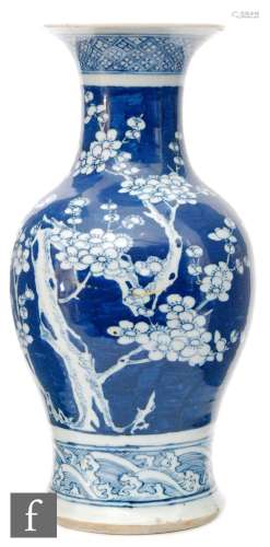 A late 19th to early 20th Century Chinese blue and white 'Prunus' vase of baluster form, the