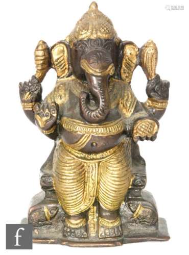 An 18th to 19th Century Indian or Himalayan bronze votive figure of Ganesha, the Hindu deity cast