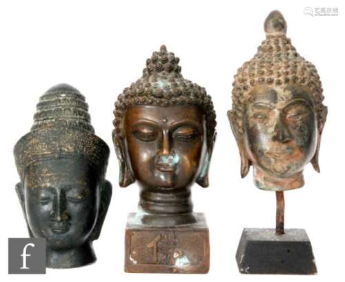 A collection of three cast metal Tibetan/Indian figures of Buddha, each modelled as a shakyamuni