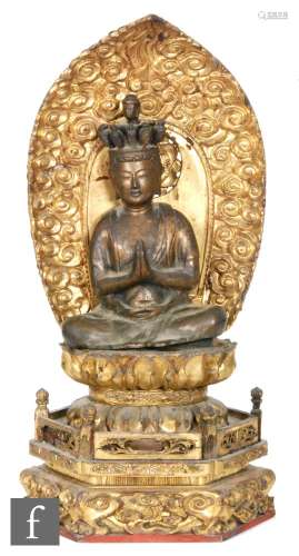 An 18th to 19th Century Sino-Tibetan gilt copper alloy figure of Vajradhara, the Adibuddha seated in