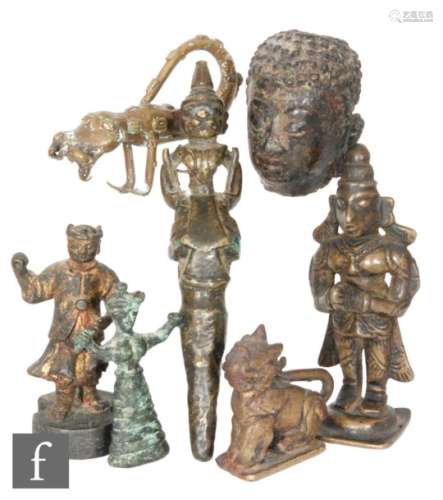 A collection of Chinese, Indian and Himilayan votive figures, to include Je Tsongkhapa, shishi,