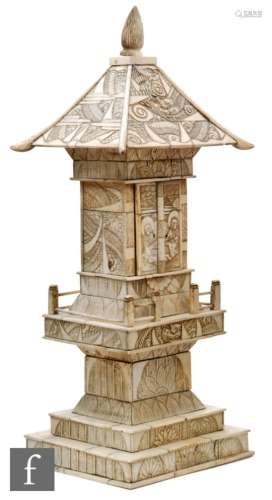 A Japanese Zushi (travelling shrine), circa 1900, of bone and ivory heavily carved with a dragon and