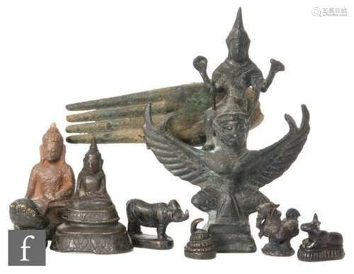 A collection of 19th to 20th Century Chinese and Indian votive figures and scroll weights, to