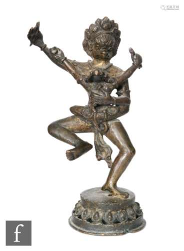 A Sino-Tibetan bronze figure of Mahakala and consort, yab yum, standing on a throne base, the god of