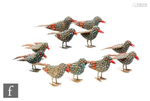A collection of mid 20th Century Nepalese bird figures, each of the standing fillagree birds applied