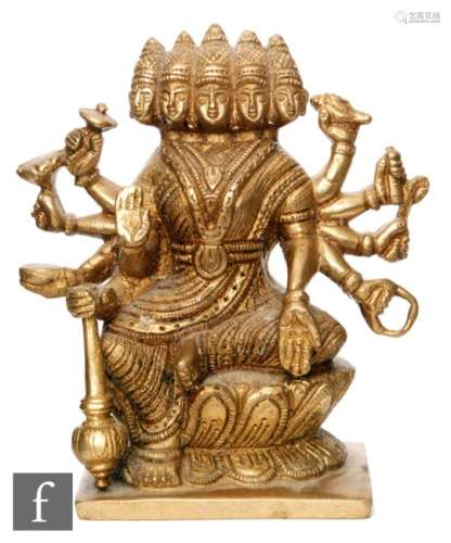 A Tibetan gilt metal Avalokitesvara shrine, the multiple headed deity raised on a double lotus base,