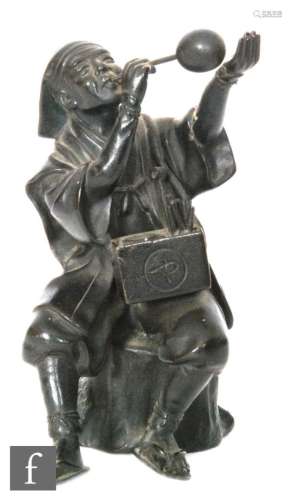 A Japanese Meiji Period (1868-1912) patinated bronze figure of a street seller, dressed in robes and