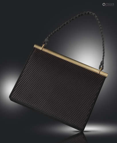 A silk and gold evening bag by Cartier