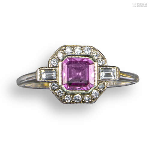 A pink sapphire and diamond ring