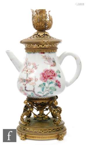 A Chinese Qianlong (1736-95) period teapot of pear form applied with loop handle and straight