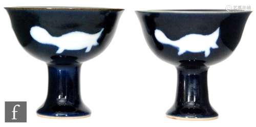 A pair of Chinese stem cups, each of the pedestal supports rising to a 'U' form bowl, with all