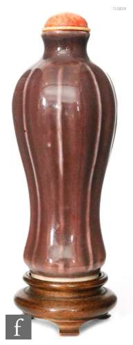 A Chinese 19th to 20th Century aubergine glazed porcelain snuff bottle of slender meiping form,
