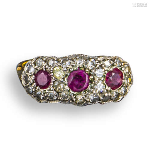 A ruby and diamond triple cluster ring