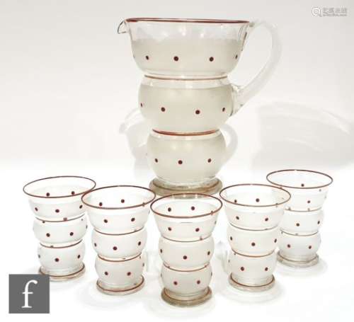 A 1940s glass lemonade set comprising jug and five glasses, all of footed stepped conical form