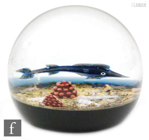 A Caithness Blue Marlin paperweight with a single fish swimming along the seabed cased in clear