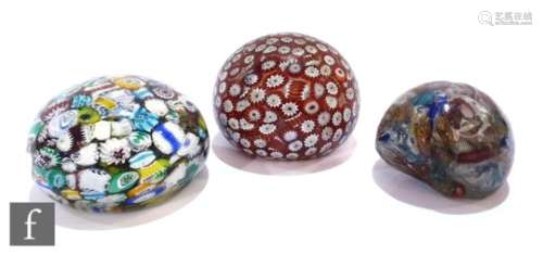 A collection of three Italian paperweights to include an example with fused murrine canes in red,