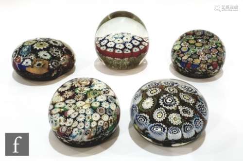 A collection of five Chinese paperweights, all with murrine canes in polychrome colours and some