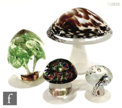 A contemporary Wedgwood mushroom form paperweight with mottled brown and green on the white ground