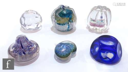 A contemporary studio glass paperweight by Robert Burch, heart shaped with internal bubbles in