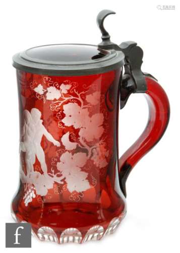 A 19th Century continental beer stein, the ruby glass flash cut and engraved with a Bacchanalian