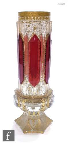 A 19th Century Bohemian vase of hexagonal form with applied ruby panels over a heavily gilded ground