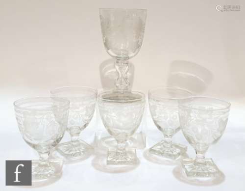 A large 19th Century clear crystal glass goblet with round funnel bowl engraved with fruiting vines,