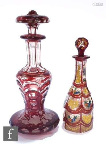 A 19th Century Bohemian scent bottle of slender bottle form with a petal cut body and enamelled