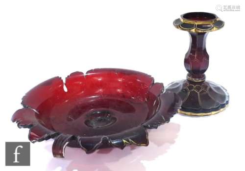 A large 19th Century Bohemain ruby glass pedestal taza with a shallow leaf form dish with partial