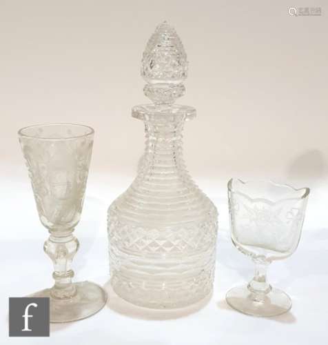 A 19th Century decanter with diamond cut body and facet cut neck below a hollow blown cut stopper,