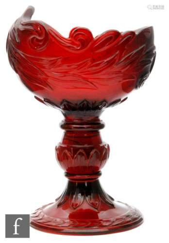 A large 19th Century ruby glass table salt, probably Russian of boat form with deeply carved foliate