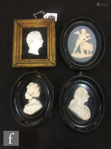 A pair of 18th Century relief moulded portrait panels in the manner of Wedgwood depicting King