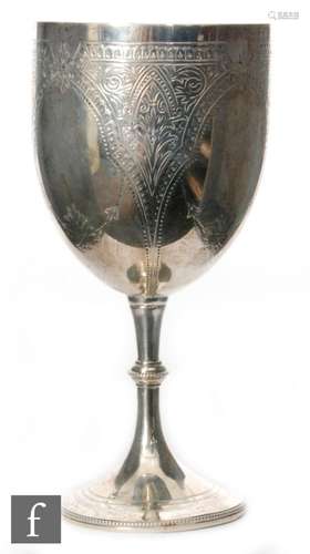 A Victorian hallmarked silver goblet with part engraved foliate decoration above bright cut spread